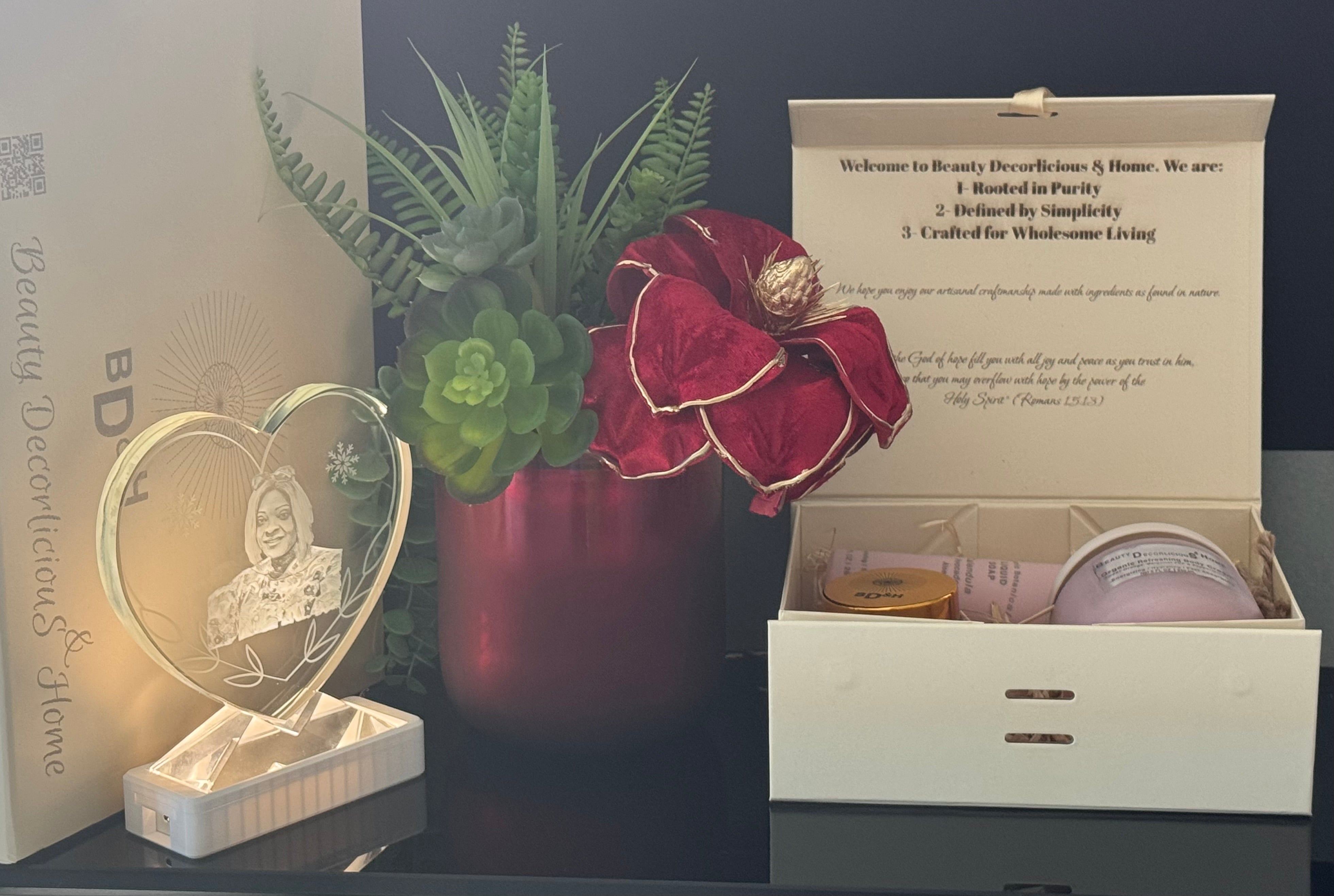 Custom luxury velvet gift box featuring a striking red velvet magnolia and realistic succulents centerpiece, paired with 100% anhydrous, organic skincare items, and personalized engraved keepsakes crafted locally right here in Texas for an unforgettable luxury gifting experience.